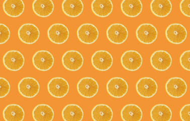 Orange fruit slices isolated on orange background. Citrus concept idea. 