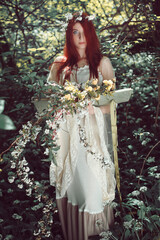 Spring goddess holding book of life