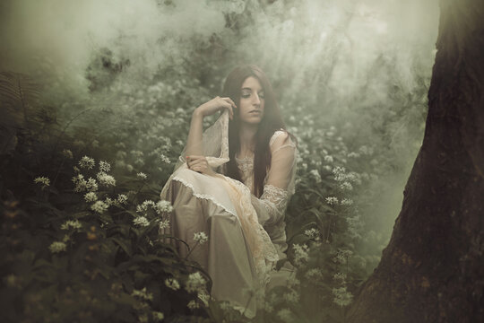 Woman in a misty secret forest