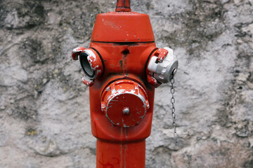 An old vintage fire hydrant very similar to a person.