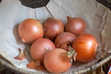 Fresh onions in a basket