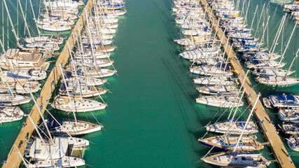 Aerial view on a marina with many boats parked.