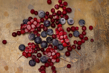 Frozen berries: blueberries, cranberries and bunches of red berries.