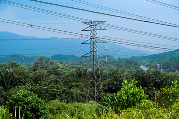 Obraz premium High voltage power tower industrial landscape at sunrise,urban power transmission lines.