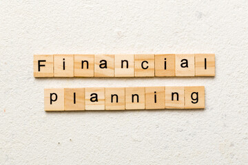 financial planning word written on wood block. financial planning text on cement table for your desing, concept