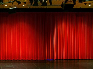 Theater scene with red velvet curtain and spotlights