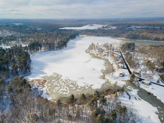 Fototapeta premium Tyngsborough historic town center and Flint Pond aerial view in spring in Tyngsborough, Massachusetts MA, USA.