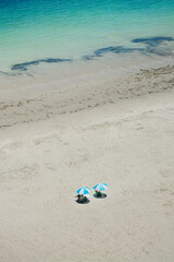 Fototapeta na wymiar vacation couple resting on white beach sand