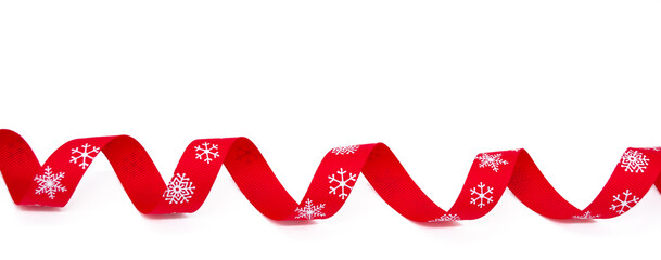 Banner with a red curling bright ribbon with snowflakes on a white background. Copy space. The concept of Christmas, St Valentine Day and gifts