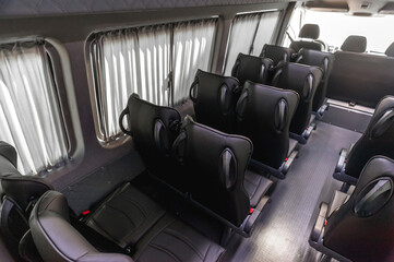 comfortable passenger bus interior with upholstered seats; individual transfer for a group of...