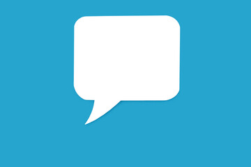Paper speech bubble in the shape of a rectangle on a blue background. Flat white chat icon in the form of an empty speech bubble. Free space for text or image. Internet communication concept