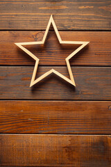 Fototapeta na wymiar Wooden star on wood boards,