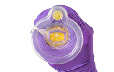 doctor medical assistant hands in purple surgical gloves holding asthma inhaler aerosol...