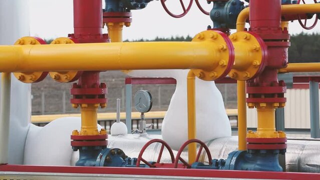 Gas and fuel yellow pipe with pressure gauge, valves and vents in gas transmission and pumping plant. Oil refinery chemical plant