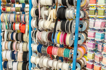 Assortment of multicolored ribbons in the needlework store