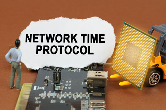 On the board with microcircuits lies a paper plate with the inscription - Network Time Protocol