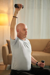Mature Man Lifting Dumbbells