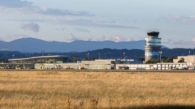 Tower, terminal and empty apron of Aerodrome Graz Thalerhof in Austria