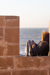 people watching the sea from the castle of Essaouira