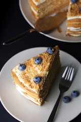 honey cake on black background