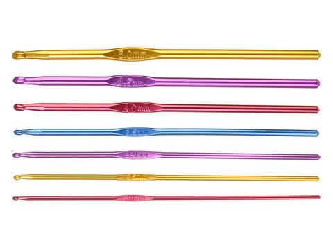 Colored hooks for wool knitting on white background