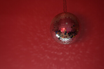mirrored disco ball on a pink wall