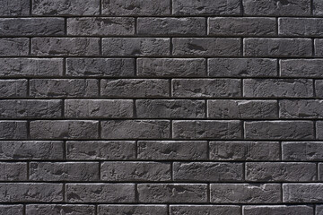 Background of gray brick wall close - up. Horizontal format. Architectural background.