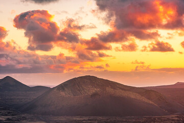 Fototapeta na wymiar Amazing sunset over El Cuervo Volcano, in Lanzarote, Canary Islands, Spain