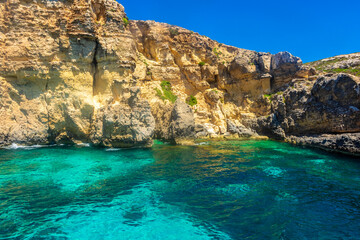 Fototapeta na wymiar The beautiful water of the Crystal Lagoon of Comino Island, Malta