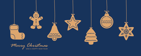 christmas card with hanging gingerbread cookies decoration on blue background