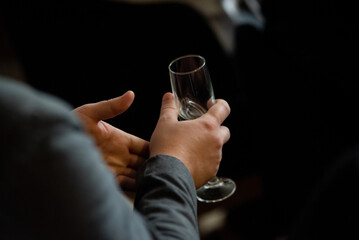person holding a glass of champagne