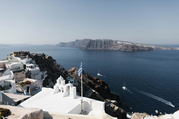 Amazing view of white houses in Oia town on Santorini island in Greece. High quality photo