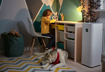 Air purifier in the children's room with an allergy child and a dog