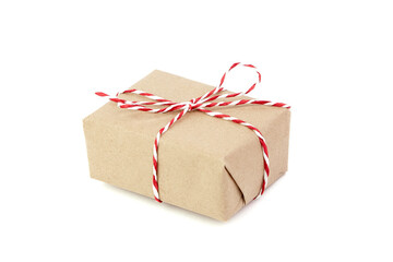 Gift box isolated on white. Wrapped Christmas or birthday present. Single gift box wrapped in craft paper, closeup