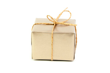 Gift box with bow isolated on white. Wrapped Christmas or birthday golden color gift box. Single present