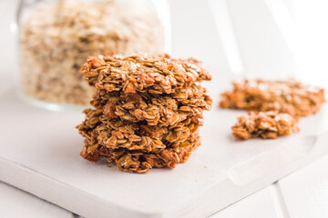 Sweet oatmeal cookies on white kitchen table.