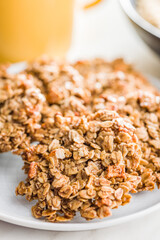 Sweet oatmeal cookies on plate on kitchen table.
