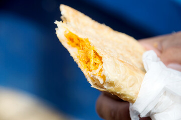 Pastry stuffed with shredded chicken and sauce