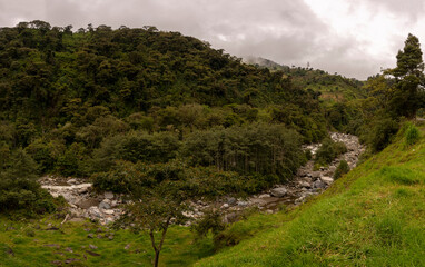 mountains and green hills with clouds in ecuador