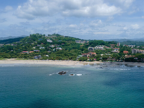 Beautiful aerial view of the Avellanas Mangrove, its iconic bridge, and the magical beach in Costa Rica Guanacaste