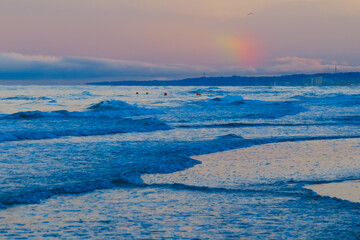 Naklejka na ściany i meble Landscape with rough sea and small rainbow - sea waves - 
