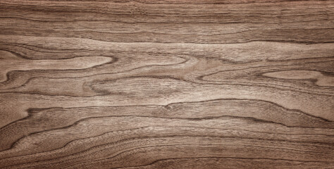 Walnut tree texture close up. Wide walnut wood texture background. Walnut veneer is used in luxury...