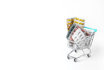 Shopping cart with many pills and drugs. free space for text. High quality photo
