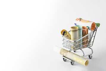 rolls of money in a shopping cart. Online store orders. free space for text. High quality photo