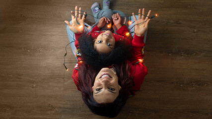 Mom and daughter with Christmas lights