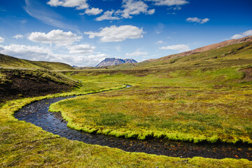 Beautiful Icelandic landscape with mountains, sky and clouds. Trekking in national park Landmannalaugar