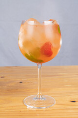 cocktail glass, on wood table