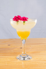 cocktail glass, on wood table