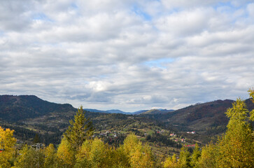 Variety of bright colors of autumn forest in the mountains. Calm and quiet majesty of the Ukrainian Carpathians