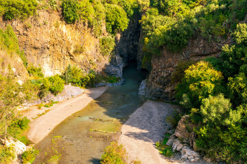 beautiful landscape with amazing view from highland with green slopes and bushes to a canyon with...
